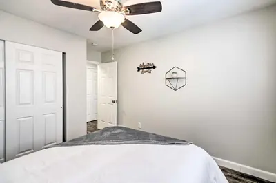 a bedroom with a bed and a ceiling fan at Loveland Duplex with Large Yard 2 Mi to Dtwn in Loveland