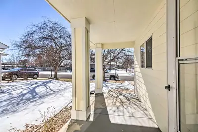 a front door of a house with snow on the ground at Loveland Duplex with Large Yard 2 Mi to Dtwn in Loveland