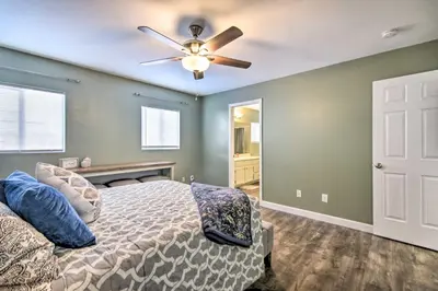 a bedroom with a bed and a ceiling fan at Loveland Duplex with Large Yard 2 Mi to Dtwn in Loveland