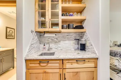 a kitchen with a sink and a counter at Walk to Lifts Studio with Hot Tub in Keystone! in Keystone