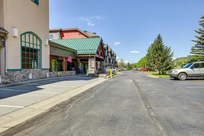 an empty street in a town with cars parked at Walk to Lifts Studio with Hot Tub in Keystone! in Keystone