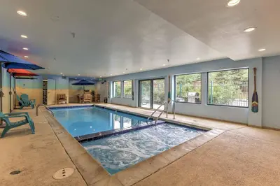 a large swimming pool in a home with windows at Walk to Lifts Studio with Hot Tub in Keystone! in Keystone