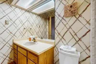 a bathroom with a sink and a toilet at Lookout Lounge in Fraser