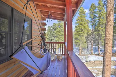 a hammock on the porch of a cabin at Black Hawk Mountain Cabin about 4 Mi to Casinos! in Black Hawk