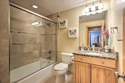 a bathroom with a shower and a toilet and a sink at Black Hawk Mountain Cabin about 4 Mi to Casinos! in Black Hawk