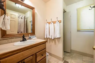 a bathroom with a sink and a mirror at Bear House -- EV #3073 home in Estes Park