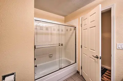 a shower with a glass door in a bathroom at 2 Blocks to Light Rail Denver Unit with Kitchenette in Greenwood Village
