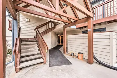 a garage with a wooden staircase in a house at 2 Blocks to Light Rail Denver Unit with Kitchenette in Greenwood Village