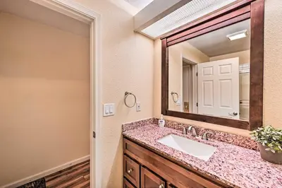 a bathroom with a sink and a mirror at 2 Blocks to Light Rail Denver Unit with Kitchenette in Greenwood Village