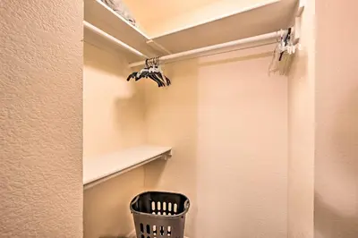 a walk in closet with a shelf and a trash can at 2 Blocks to Light Rail Denver Unit with Kitchenette in Greenwood Village