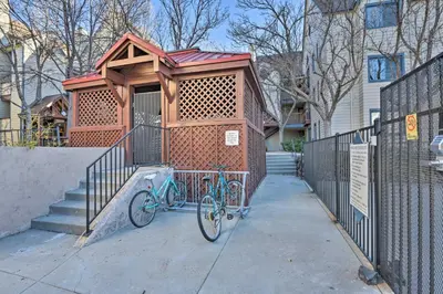 a bike parked in front of a building at Condo with Patio and Pool Access in Greenwood Village! in Greenwood Village
