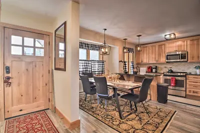 a kitchen with a table and chairs in a room at Cozy Mountain Getaway with Ski Shuttle Access! in Fraser