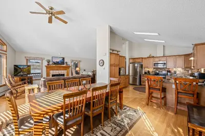 a kitchen and dining room with a table and chairs at Lily Mountain Lodge - Amazing Mountains Views, Private Hot Tub, Great Location in Estes Park