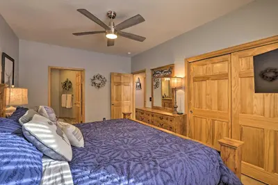 a bedroom with a bed and a ceiling fan at Mountainside Grand Lake Condo with Patio! in Grand Lake