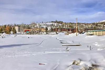 a parking lot covered in snow with buildings at Mountainside Grand Lake Condo with Patio! in Grand Lake