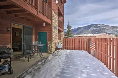 a porch of a house with snow on the ground at Mountainside Grand Lake Condo with Patio! in Grand Lake