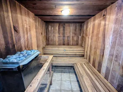 a wooden sauna with a tub in a room at Lenawee 1741 by SummitCove Lodging in Keystone