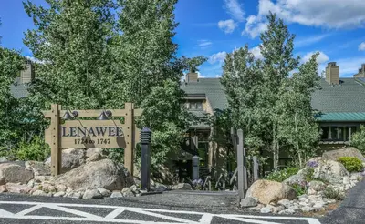 a sign for the levenve hotel with trees at Lenawee 1741 by SummitCove Lodging in Keystone
