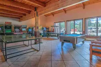 a large room with a pool table and arcade games at Sun & Snow Chalet Breckenridge, a dog lovers dream! in Breckenridge