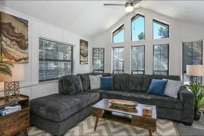 a living room with a couch and a table at Sun & Snow Chalet Breckenridge, a dog lovers dream! in Breckenridge