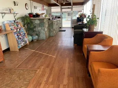a room with a hard wood floor in a store at Fort Collins Inn in Fort Collins