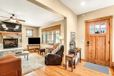 a living room with a couch and a fireplace at Winter Park Trail House in Fraser