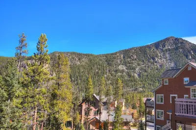 a town with a mountain in the background at Settlers Creek in Keystone