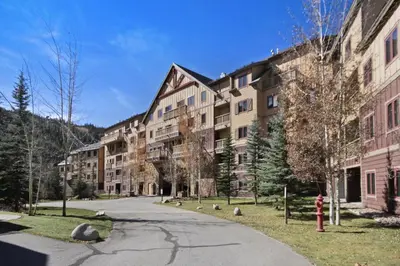 an empty street in front of an apartment building at Red Hawk Lodge Condo in Keystone
