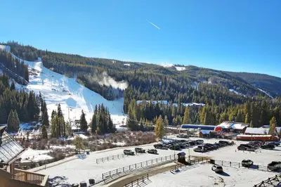 a view of a ski resort with a snow covered mountain at Red Hawk Lodge Condo in Keystone