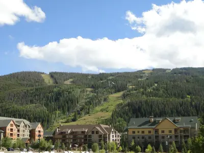 a town with a mountain in the background with houses at Dakota Lodge in Keystone