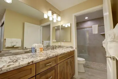 a bathroom with a sink and a shower and a toilet at 201 Point Drive condo in Frisco
