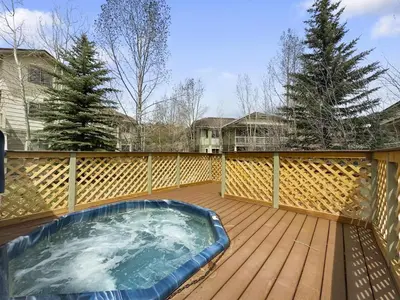 a hot tub on the deck of a house at 201 Point Drive condo in Frisco