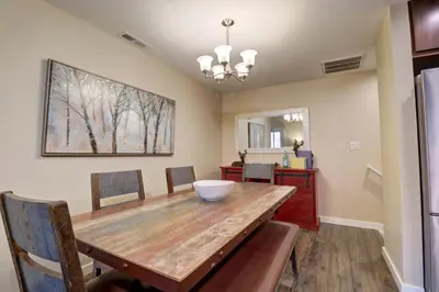 a dining room with a wooden table and chairs at 201 Point Drive condo in Frisco