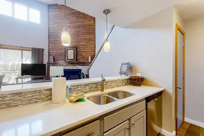 a kitchen with a sink and a counter top at Montezuma Magic in Keystone