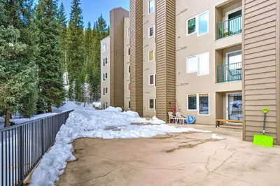 a pile of snow in front of a building at Chic Winter Park Studio with Community Hot Tub in Winter Park