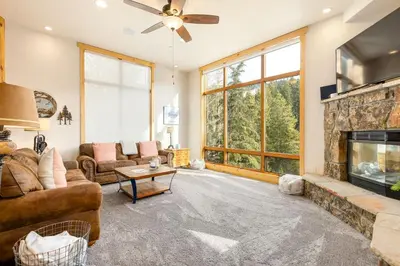 a living room with a couch and a fireplace at 8201 Mill Creek - Private Hot Tub! condo in Dillon
