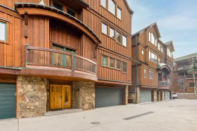 a large wooden building with a balcony on it at 8201 Mill Creek - Private Hot Tub! condo in Dillon