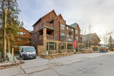 a building with a van parked in front of it at 8201 Mill Creek - Private Hot Tub! condo in Dillon