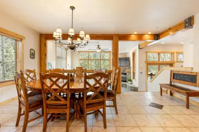 a dining room with a wooden table and chairs at 8201 Mill Creek - Private Hot Tub! condo in Dillon