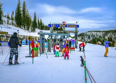 a group of people on skis at a ski station at Bear Trail townhouse in Winter Park