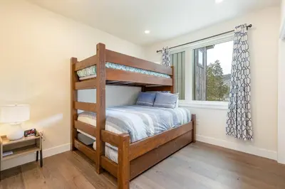 a bedroom with a bunk bed and a window at 204 Clearwater Lofts condo in Keystone