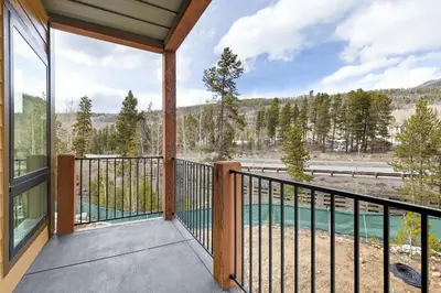 a balcony with a view of a river at 204 Clearwater Lofts condo in Keystone