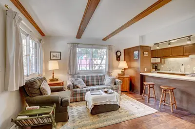 a living room with a couch and a table at Fall River Casita in Estes Park