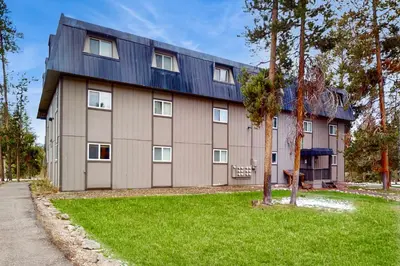 a large building with a gambrel roof at Hi Country Haus Hideaway in Winter Park