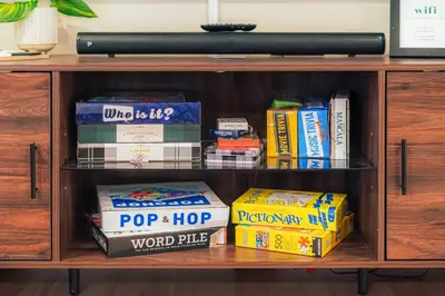 a book shelf filled with lots of books at Scenic Conifer Getaway with Game Room and Hot Tub! in Conifer