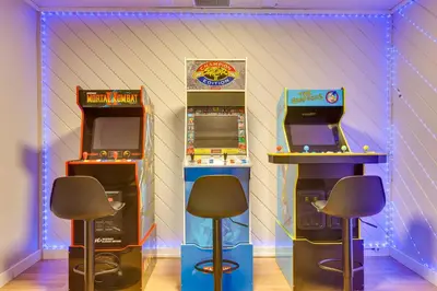 two arcade video games in a room with two machines at Scenic Conifer Getaway with Game Room and Hot Tub! in Conifer