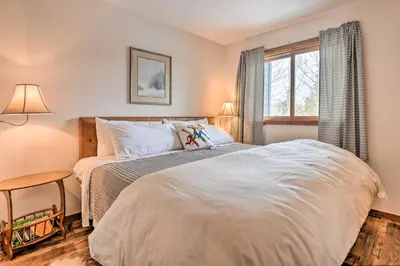 a bedroom with a bed and a window at Private Balcony and Resort Perks Silverthorne Condo in Silverthorne