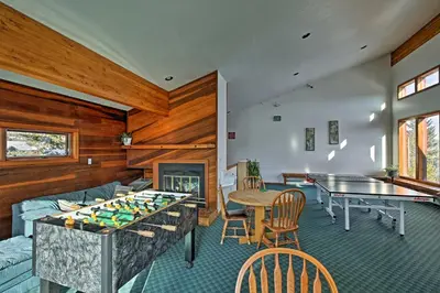 a living room with a pool table and a ping pong table at Private Balcony and Resort Perks Silverthorne Condo in Silverthorne
