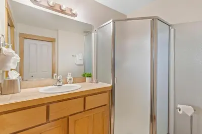 a bathroom with a sink and a shower at Sleek Condo - Near Park, Poudre River and Old Town in Fort Collins