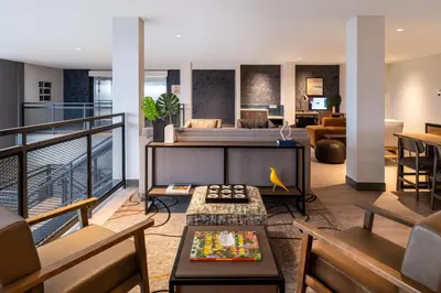 a living room with a couch and a table at Atwell Suites Denver Airport - Tower Road by IHG in Denver